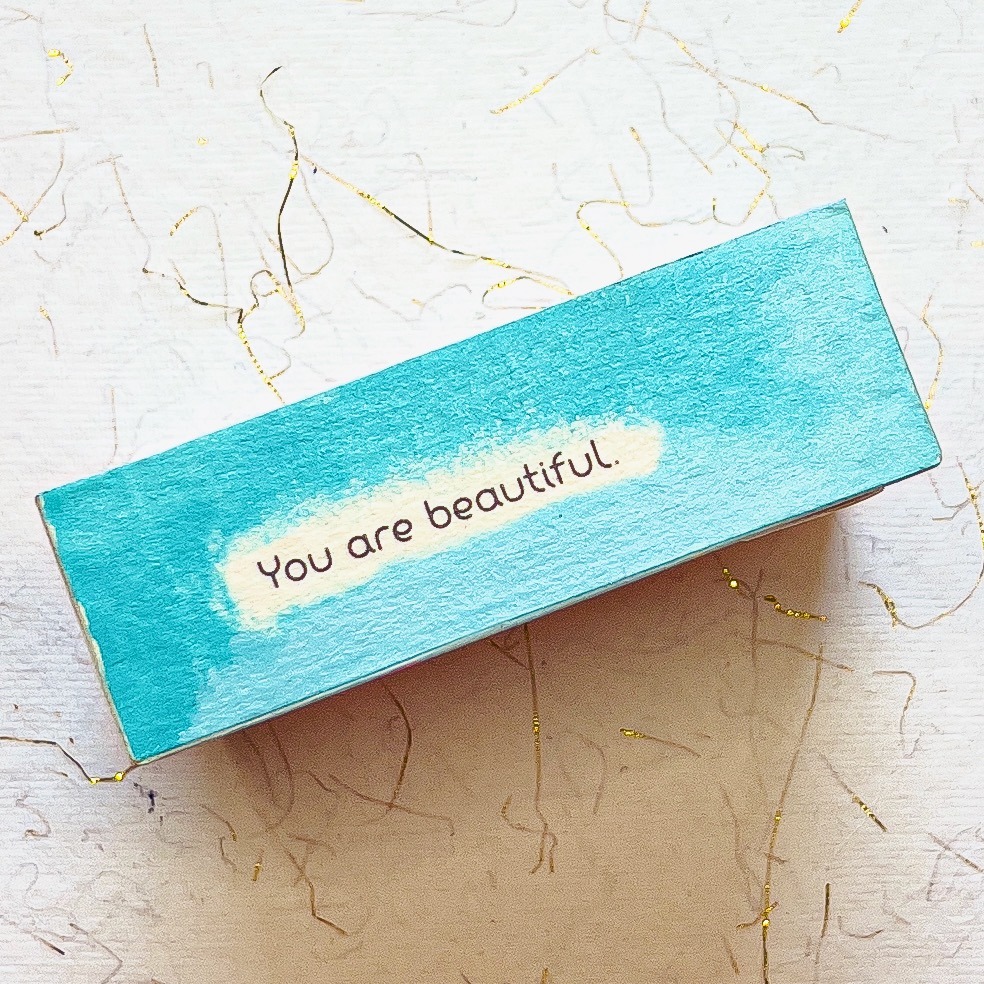 side of a mini abstract artwork, turquoise with quote